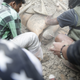 People try to free a man from the rubble of a destroyed building (EPA/Narendra Shrestha)